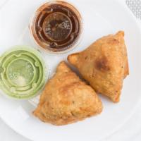 Veggie Samosa (2 Pieces) · Deep fried mixed vegetable turnovers ground beef.