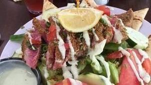 Asian Ahi Sunflower Crusted Tuna Salad · gluten Free. Served rare on top of a garden salad with a drizzle of wasabi and your choice o...