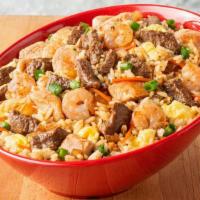 Supreme Fried Rice · Premium steak, marinated chicken and fresh shrimp reign supreme in this fried rice bowl, ser...