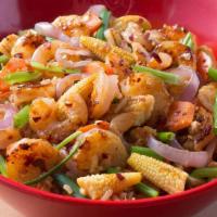 Kung Pao · Your choice of protein, with baby corn, carrots, and green onions in in a spicy Kung Pao sau...