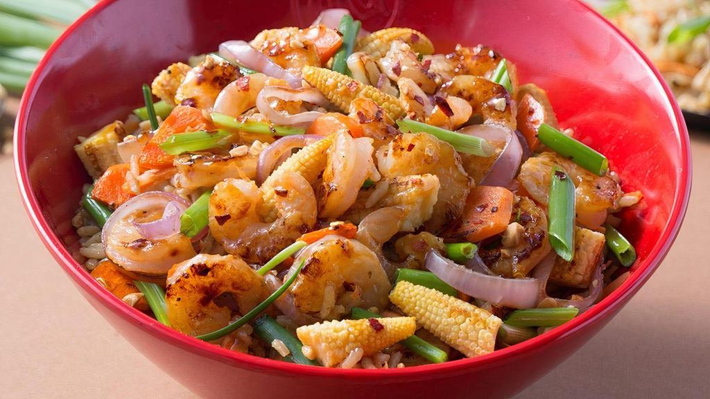 Kung Pao · Your choice of protein, with baby corn, carrots, and green onions in in a spicy Kung Pao sauce with fried rice or your choice of base. Topped with roasted peanuts.