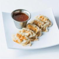Pork Potstickers · Prepare your taste buds for battle with a seared wonton wrapper stuffed with marinated pork ...