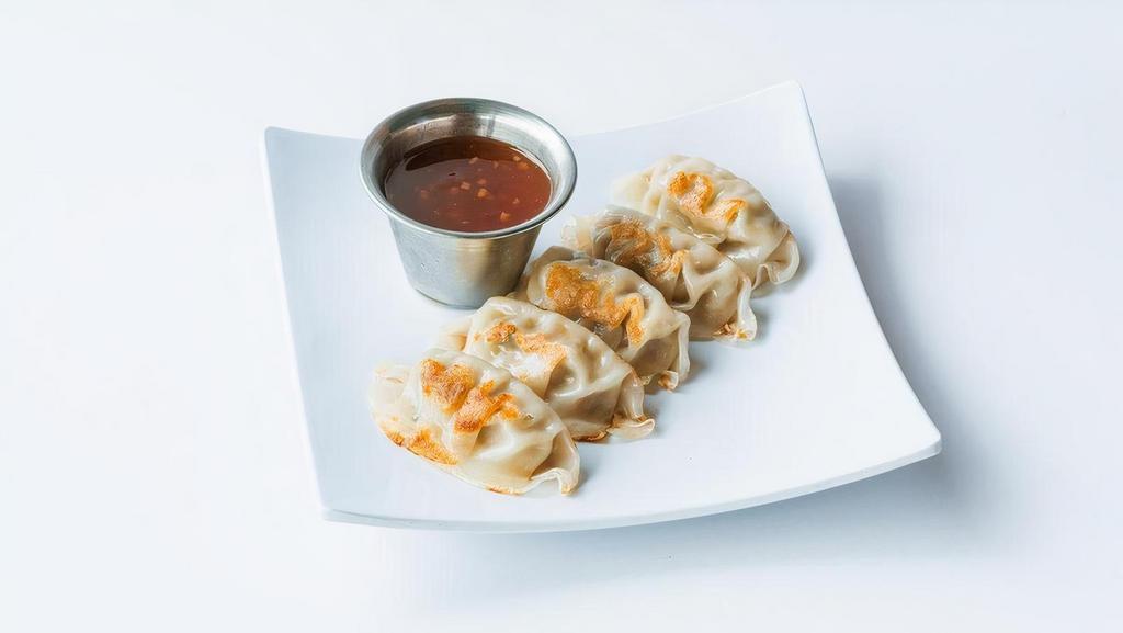 Pork Potstickers · Prepare your taste buds for battle with a seared wonton wrapper stuffed with marinated pork and served with Dragon sauce.