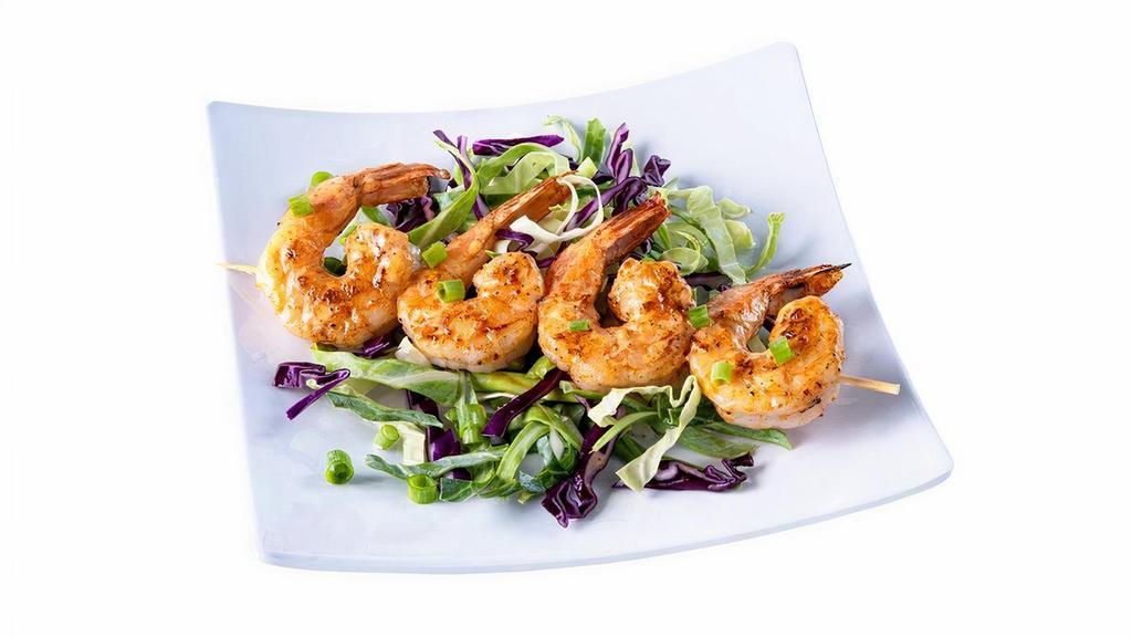 Dynamite Shrimp · 4 Jumbo tail-on Shrimp, grilled & tossed in. our house-made Dynamite Sauce!.