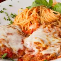 Chicken Parmigiana · Breaded chicken breast layered with ricotta cheese, baked with tomato basil sauce and mozzar...