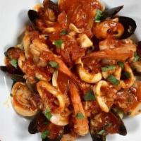 Seafood Festival · Sautéed jumbo shrimp, black mussels, middle neck clams, and calamari in an extra virgin oliv...