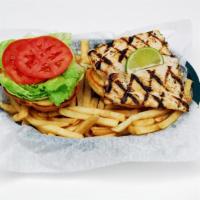 Fish Sandwich · Premium fish fillet served grilled or blackened on a toasted brioche bun with lettuce, tomat...