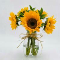 Ukraine · 5 sunflowers with leaves in a vase and a bow.              
These are national Ukrainian flo...