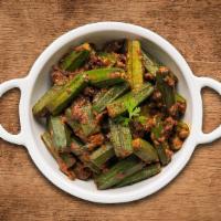 Okra Masala  · Semi-dry curry made with okra, spices, onions and tomatoes served with a side of rice