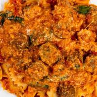 Skillet Lasagna · Marinara sauce, meatballs, ricotta, romano, mozzarella, garlic, and spinach.
