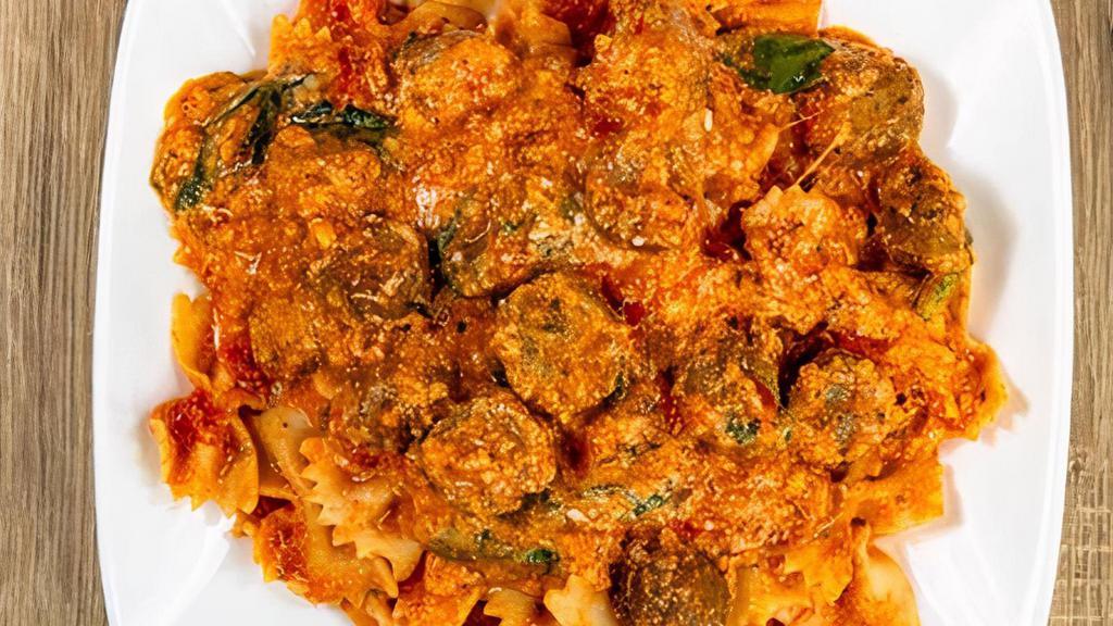 Skillet Lasagna · Marinara sauce, meatballs, ricotta, romano, mozzarella, garlic, and spinach.