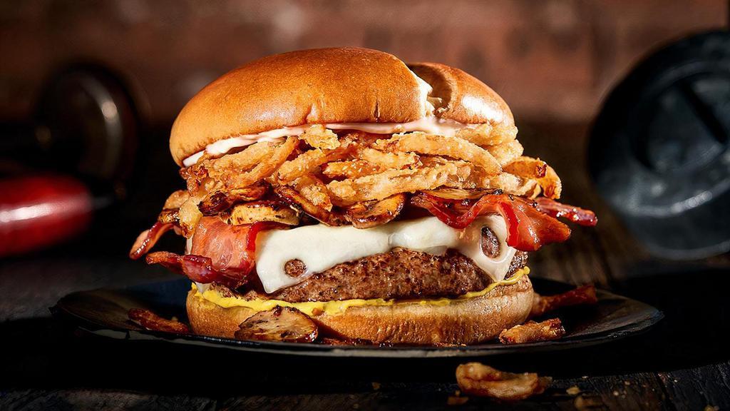 The Matterhorn · A juicy Chuck Burger with Swiss cheese, smokey bacon, sautéed mushrooms, fried onion tanglers, mustard and mayo. It’s a (forgive us) mountain of flavor.