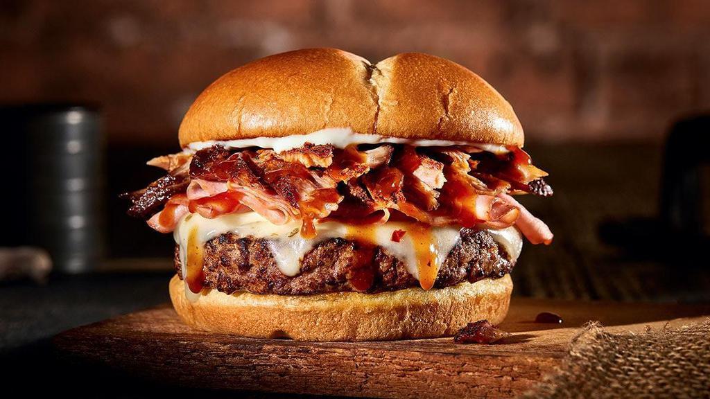 The Meat Grinder · A thick Chuck Burger with thin sliced ham, shredded pork, pepper jack cheese, chipotle BBQ sauce and mayo. Vegans probably should avoid this one.