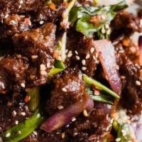 Mongolian Beef Bowl · Stir fried in a sesame sweet soy sauce, white rice, scallions and steam bok choy or pickled ...
