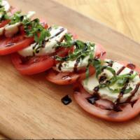 Caprese · Fresh Mozzarella, Tomatoes, Fresh Basil,  Balsamic Glaze.. Served With Focaccia Bread