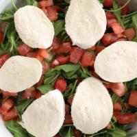 Azzurra Salad · Spring Mix Greens, Romaine, Arugula, Fresh Mozzarella, Fresh Tomatoes