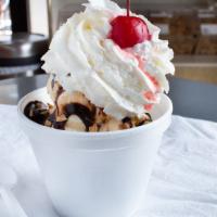 Large Sundea · ice cream, peanut, hot fudge, & whip cream with a cherry on top.