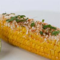 Elotes · Roasted corn on the cob with cilantro mayonnaise and cotija cheese.