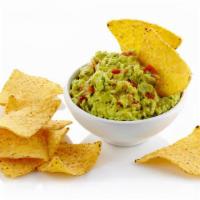 Chips & Guacamole · Homemade tortilla chips with guacamole, red and green salsa.