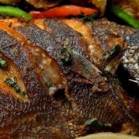 Whole Tilapia/Side · A Whole Tilapia Fish, fried and cooked in Tomato Sauce, Choice of Rice, Plantain or Yam