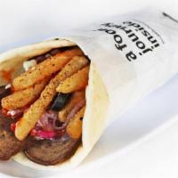 Gyro Wrap With Fries · Pita gyro wrap with gyro meat, crunchy fries, pita bread topped with feta spread , tzaziki ,...