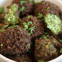 Falafel & Tahini · Best Authentic Falafel (4 pieces), made with chickpeas, fresh herb, and the right spices. Pa...