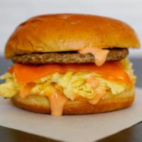 Sausage, Egg, And Cheddar Brioche Sandwich · 2 fresh cracked cage-free scrambled eggs, melted Cheddar cheese, breakfast sausage, and srir...