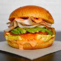 Smoked Turkey, Egg, And Avocado Brioche Sandwich · 2 fresh cracked cage-free scrambled eggs, melted Cheddar cheese, smokey turkey, avocado, and...