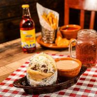 Arepas Rellenas / Stuffed Corn Cake · Corn cake stuffed with cheese and juicy shredded beef or chicken