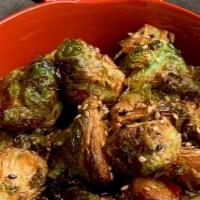 Crispy Brussels Sprouts · Deep-fried brussels sprouts glazed with house sweet red chili sauce