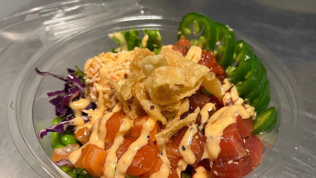 The Big Boss Bowl · Seasoned tuna, salmon, spicy tuna, crab salad, lettuce, carrots, cabbage, cucumber, avocado, edamame, beets, eel sauce, spicy mayo, pickled ginger, crispy wonton strips, and jalapeno slices