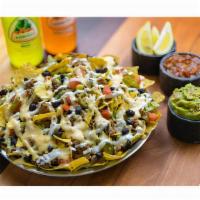 Nachos · Start off with our mouthwatering nachos, then add your choice of protein and all the fixins ...