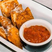 Toasted Ravioli Del · Served with red sauce for dipping.
