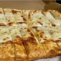 Garlic Cheese Sticks · Fresh baked pizza dough covered in garlic and butter and mozzarella with a side of pizza sau...