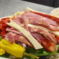 Antipasto · Capicola, Genoa salami, crisp romaine and spring mix salad, tomatoes, onions, provolone, roa...