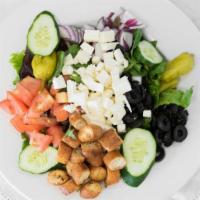 Greek · Served over garden salad with feta cheese, pepperoncini peppers, crisp romaine lettuce, onio...