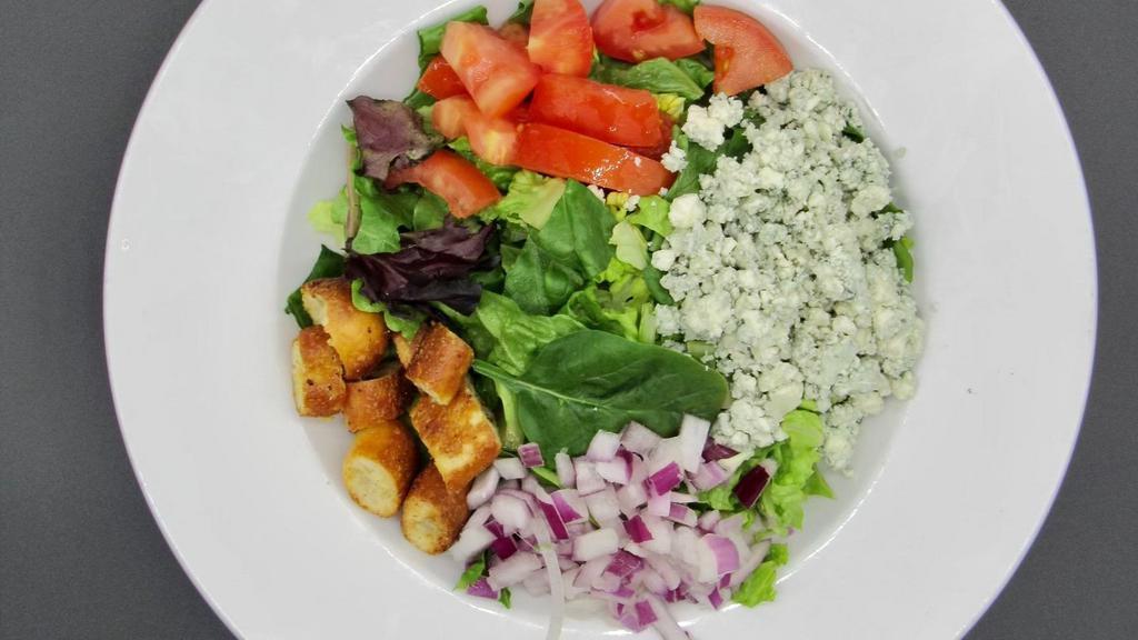 Gorgonzola · Gorgonzola cheese, garden fresh romaine lettuce mixed with spring mix salad, tomatoes, onions and homemade croutons.