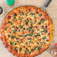 Greek Pizza · Feta cheese, spinach, black olives, onions, tomatoes and mozzarella.