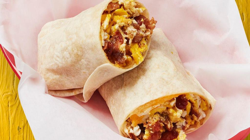 Bacon, Egg, & Cheese Burrito · Diced bacon, egg, and cheese wrapped in a large flour tortilla.. {GF - with soft corn or crispy corn tortillas *please note that crispy taco shells are fried in a fryer that may allow cross-contact in some locations. Also, soft corn tortillas are warmed on the same surface as flour tortillas in some locations}, {DF - remove shredded cheese}