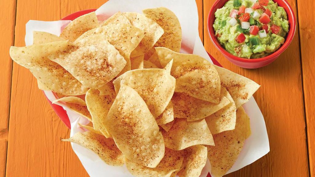 Chips & Guacamole · Basket of fresh tortilla chips seasoned with Fuzzy Dust and served with house-made Guacamole.. {DF}, {GF - please note that chips are fried in a fryer that may allow cross-contact in some locations}