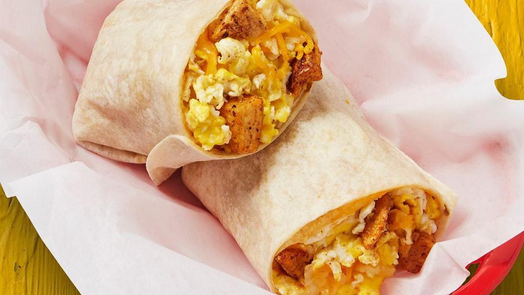 Potatoes, Egg, & Cheese Burrito · Potatoes, egg, and cheese wrapped in a large flour tortilla.. {DF - remove shredded cheese}