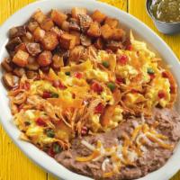 Chilaquiles · Two scrambled eggs, choice of meat, tortillas strips, shredded cheese, and pico de gallo. Se...