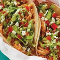 Spicy Pork Taco · Spicy pork served on a soft corn tortilla and topped with garlic sauce, lettuce, tomatoes, s...