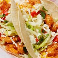 Grilled Shrimp Taco · Grilled shrimp served on a soft corn tortilla and topped with garlic sauce, lettuce, tomatoe...