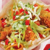 Fried Avocado Taco · Fried avocado slices served on a soft corn tortilla and topped with garlic sauce, lettuce, t...