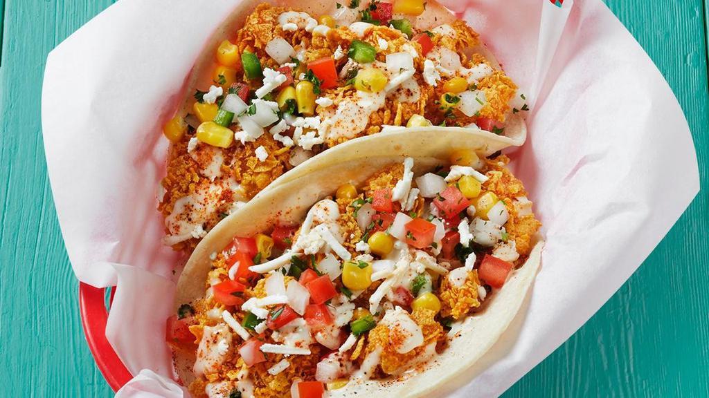 Queso Shrimpico Taco · Shrimp corn queso taco with choice of grilled or tempura shrimp with garlic sauce, corn pico, feta cheese and our famous queso sprinkled with Fuzzy Dust..