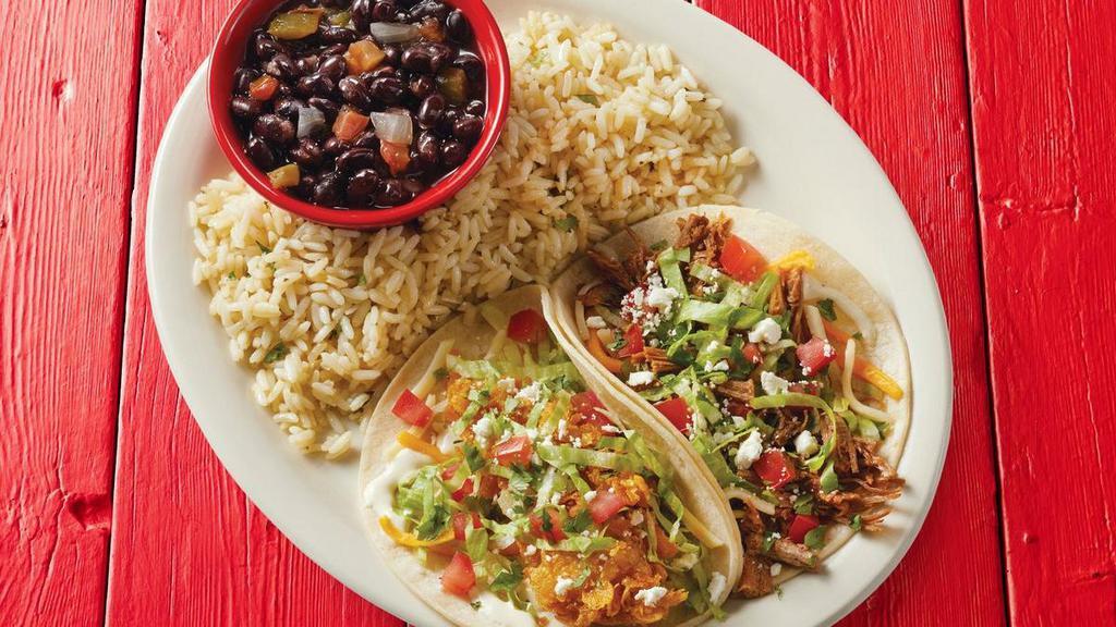 Taco Plate · *FAN FAVORITE - Choose any two tacos with your choice of two sides.. {GF - select 2 gluten-free tacos and 2 gluten-free sides}