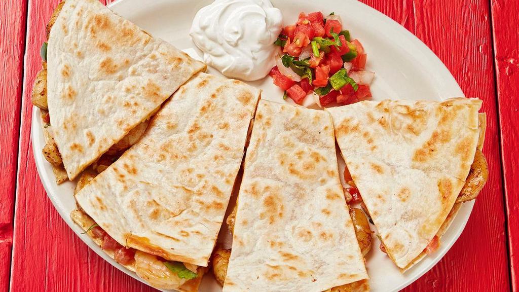 Grilled Shrimp Quesadilla · Grilled flour tortillas stuffed with grilled shrimp, shredded cheese, pico de gallo, and garlic sauce. Served with a side of sour cream and pico de gallo.