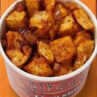 Latin-Fried Potatoes · Diced potatoes cooked with onions and seasoned with Fuzzy Dust.. {GF}, {DF}