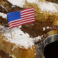 Nutella French Toast · Thick cut challah bread, dipped in egg batter with a special touch of cinnamon and vanilla e...